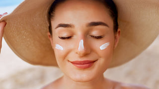 Women wearing sunscreen in the summer with a hat